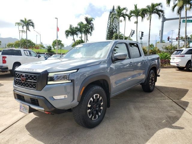 2023 Nissan Frontier PRO-4X in Boulder Gray Pearl — front three-quarter view
